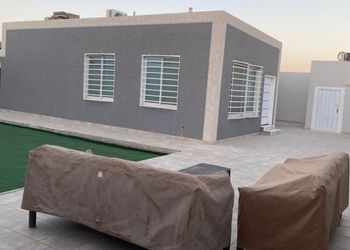 استراحة بمسطح اخضر و جلسة خارجية