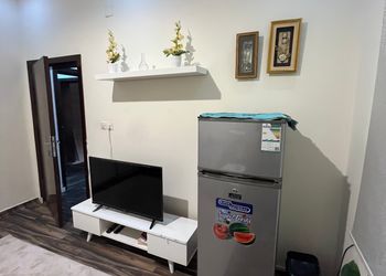 استديو بسرير مفرد وجلسة مريحة