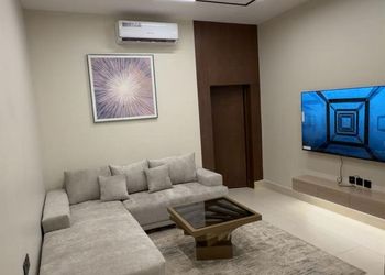 شقة بغرفة معيشة وغرفة نوم