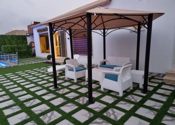 استراحة بمسطح اخضر وجلسه خارجيه